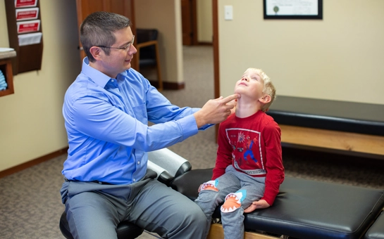 Chiropractor Watertown SD Bryan Dingsor With Boy